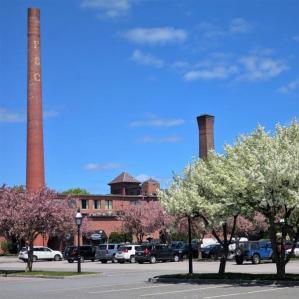 Photo of the historic Colony Mill and smokestacks on West Street in Keene