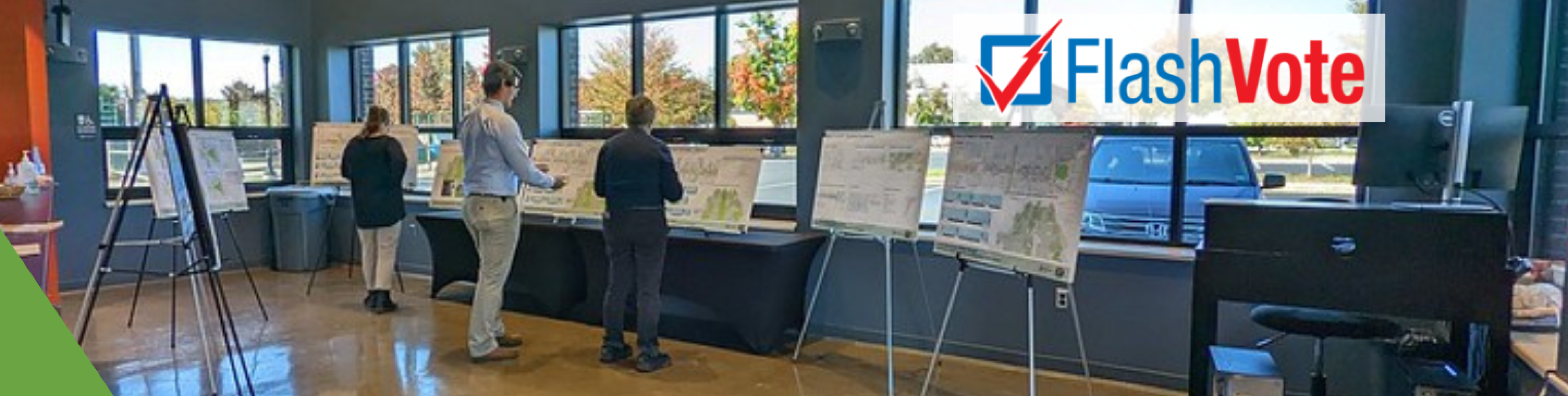 Three people looking at city plans