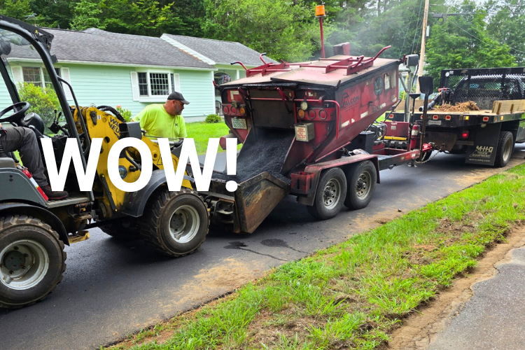 Public Works staff working hard with asphalt equipment on a Keene road