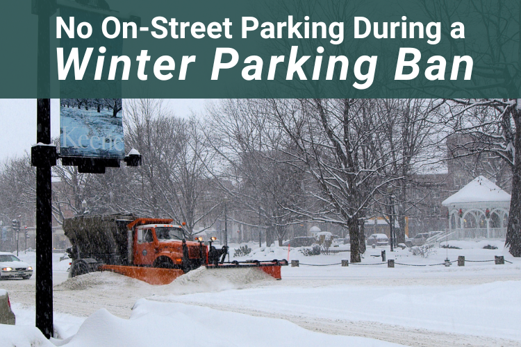 a large truck plowing snow on a downtown street