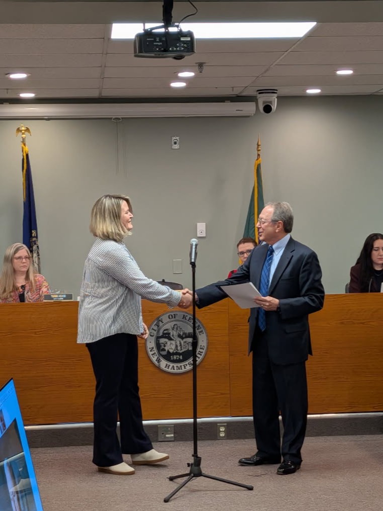 Mayor Kahn presenting the proclamation to Carrah Fisk-Hennessey
